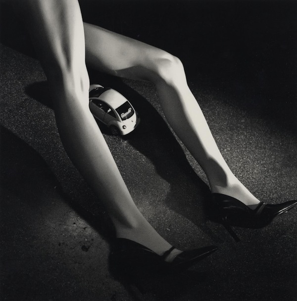 Helmut Newton Woman receiving Beetle 1999